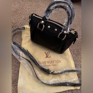 Brand new purse with embossed logo